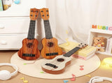 Mahogany color 17-inch Playable Ukulele Mini Guitar, lightweight and portable. Features comfortable V1102-KTZXJT001