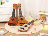 Acacia wood 17-inch Playable Ukulele Mini Guitar, lightweight and portable. Features comfortable V1106-XJT002